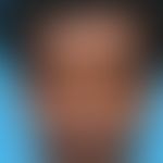 Vitiligo: Sharply defined, depigmented spots on the head and neck in a 31-year-old patient with s...